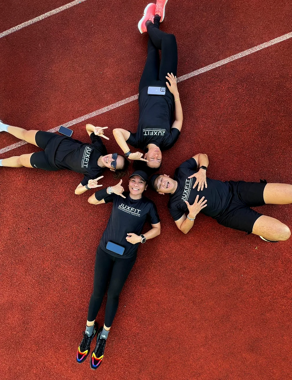 JUXFIT athletes recovering together on the track